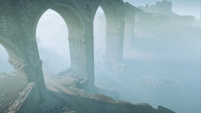 Stone bridge ruins in a foggy landscape