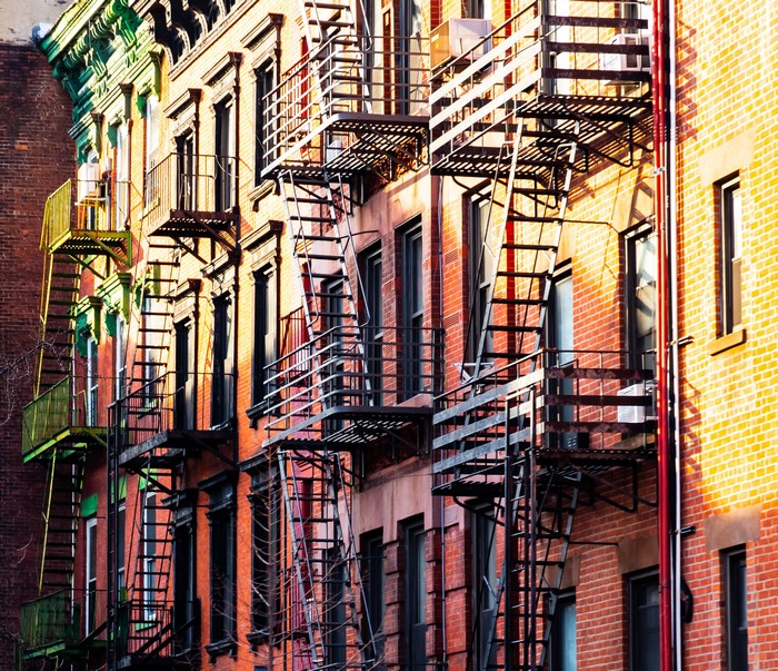 New York City apartment buildings with fire escapes