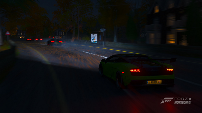 Green sports car driving at night in Forza Horizon 4
