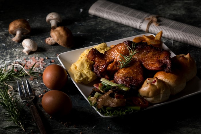 Roast chicken with eggs, bread, and mushrooms
