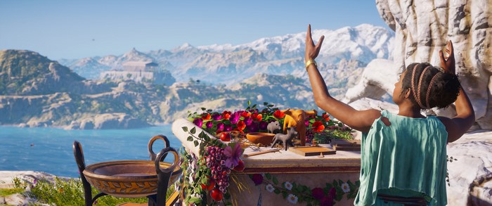 Woman praying at an altar in Assassin's Creed Odyssey