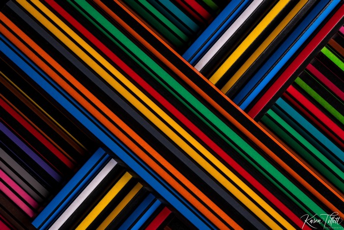 Colorful pencils arranged in diagonal lines