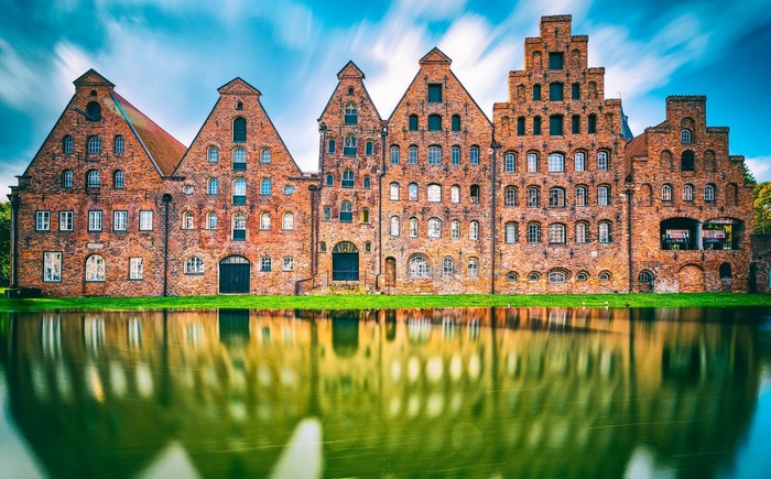 Warehouses reflected in water in Lübeck, Germany