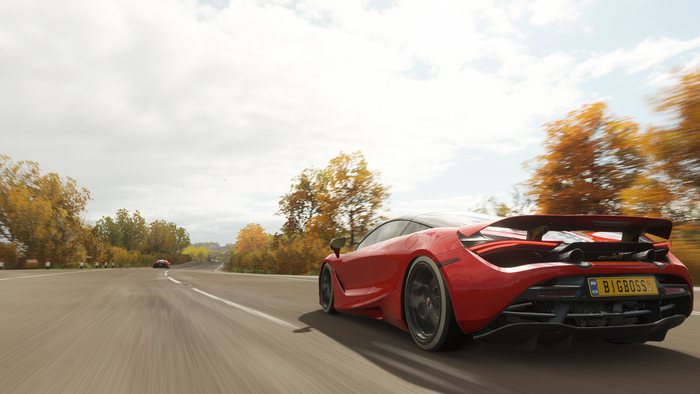 Red McLaren 720S driving on a road in Forza Horizon 4