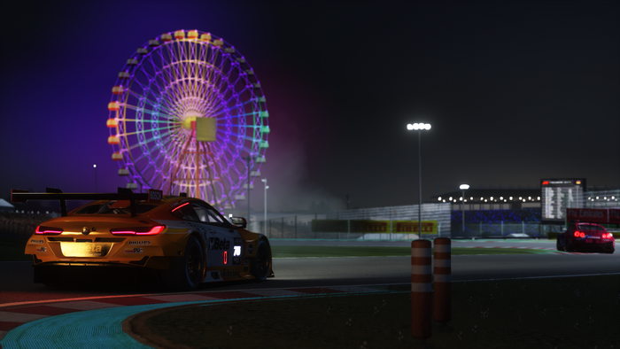 BMW M8 GTE and Nissan GT-R NISMO on a race track at night