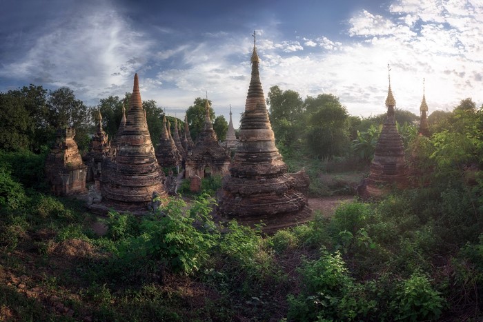 Ancient stupas in a lush forest in Myanmar