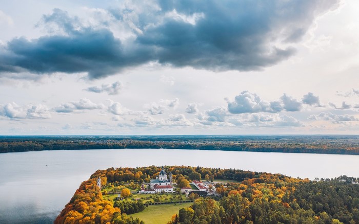 Monastery on a peninsula in autumn by the lake