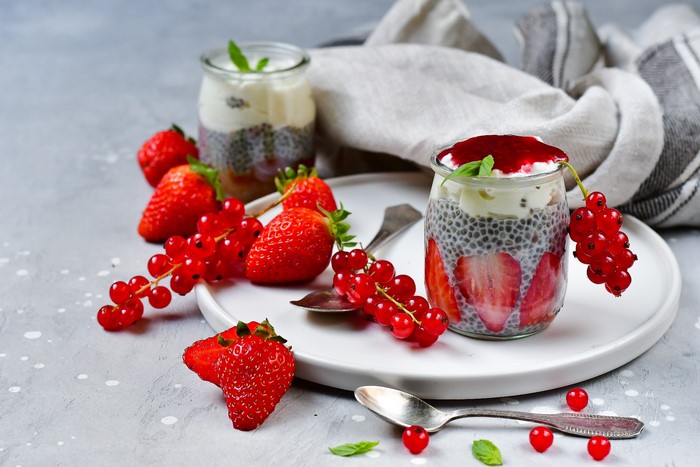 Chia seed pudding with strawberries and red currants