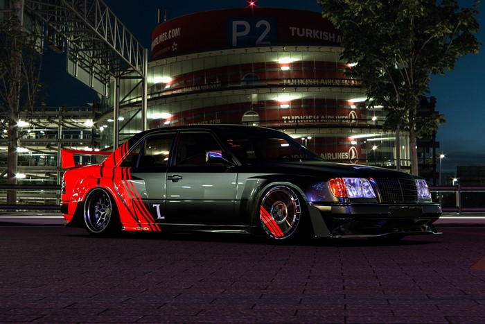 Modified Mercedes-Benz sedan with red accents at night