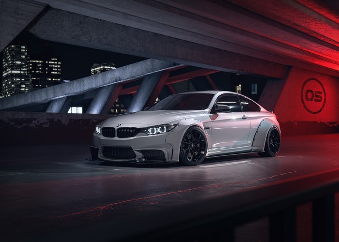 White Widebody BMW M4 Coupe with Black Wheels