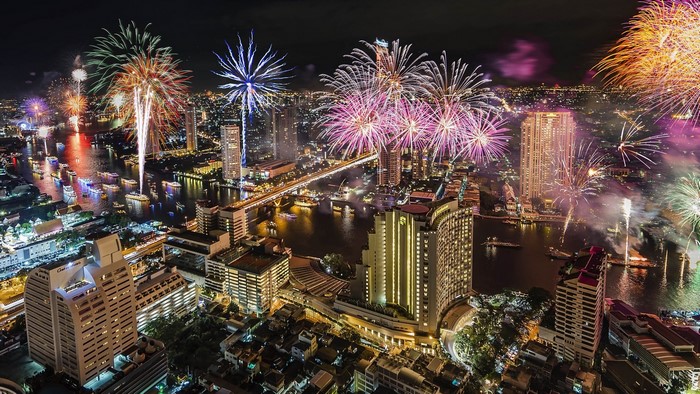 Bangkok skyline with fireworks over the Chao Phraya River