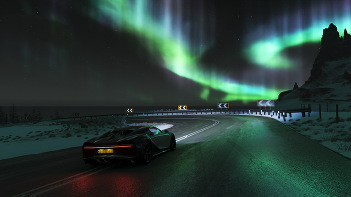 Bugatti Chiron driving on a road under the Aurora Borealis in Forza Horizon 4