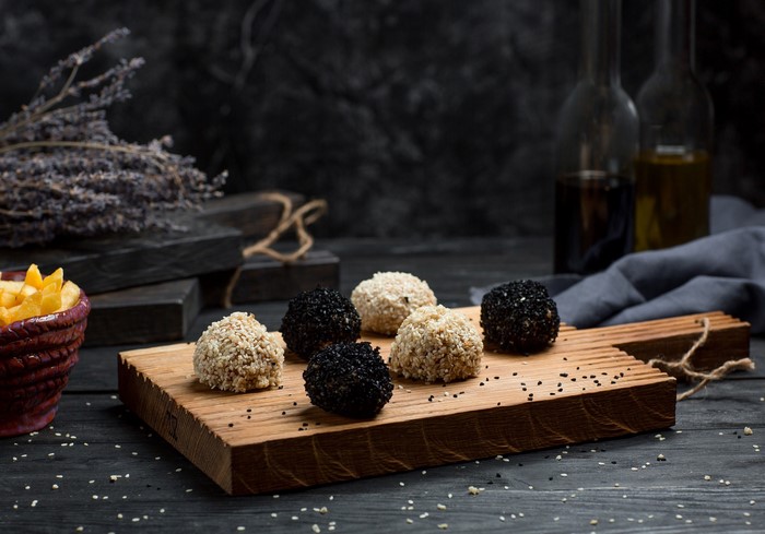 Sesame seed balls on a wooden board