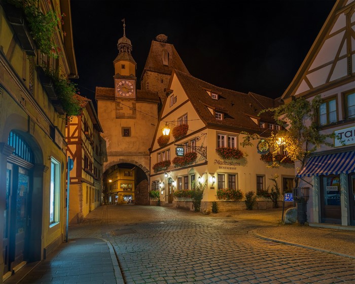 Night view of a cobblestone street in Rothenburg ob der Tauber, Germany