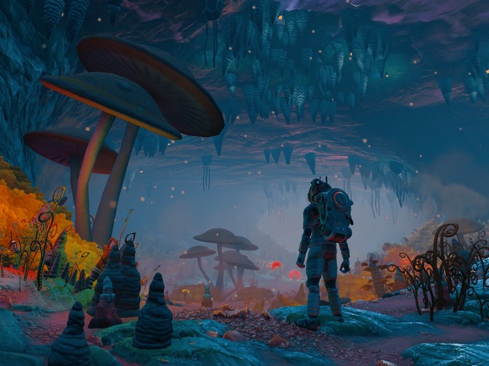 Astronaut exploring a cave with giant mushrooms in No Man's Sky
