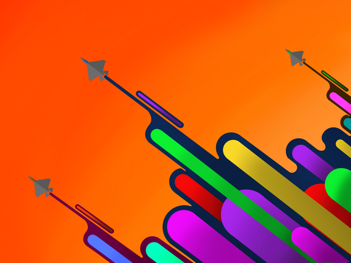 Gray fighter jets flying on orange background with colorful trails