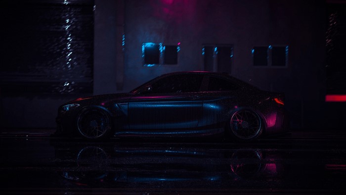 Dark car in the rain with neon lights