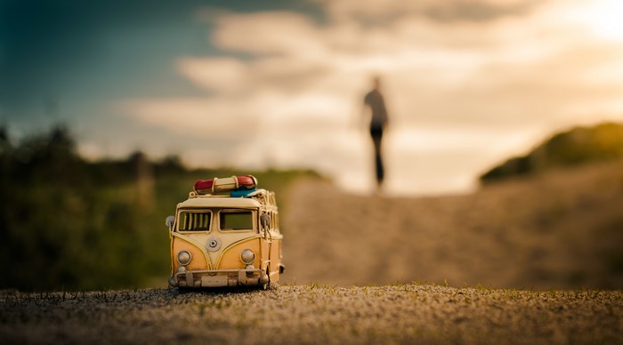 Toy van on a road at sunset