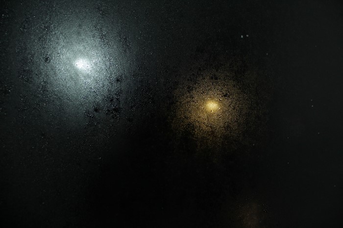 Two lights on a wet surface