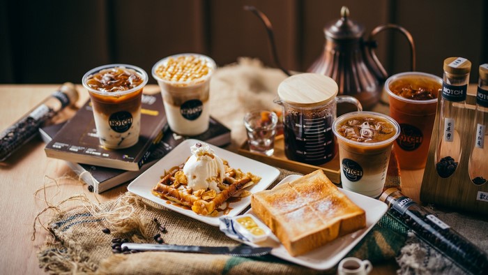 Coffee drinks, waffles, and toast with books