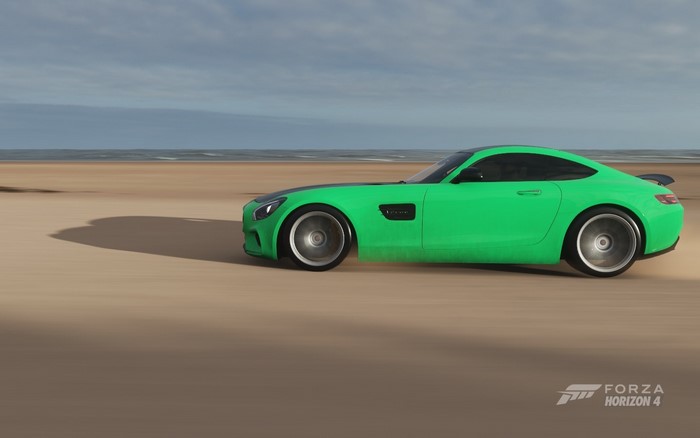 Green Mercedes-Benz AMG GT driving on a beach in Forza Horizon 4