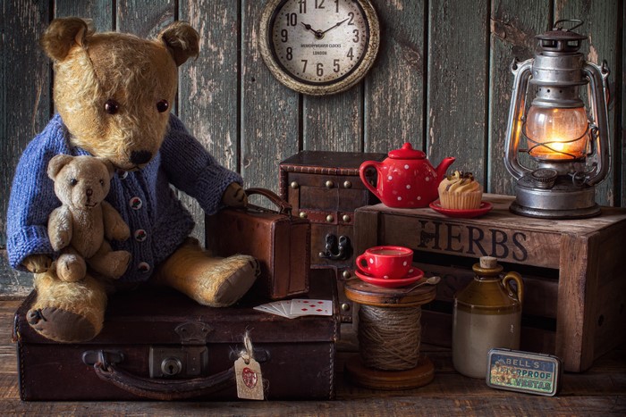 Teddy bears with luggage, tea set, and lantern