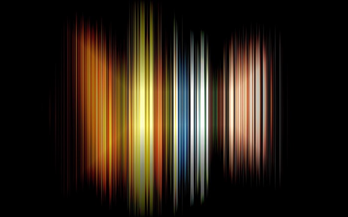 Abstract vertical light streaks on black background