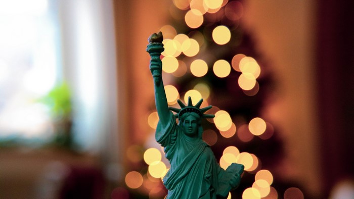 Statue of Liberty miniature with bokeh Christmas lights