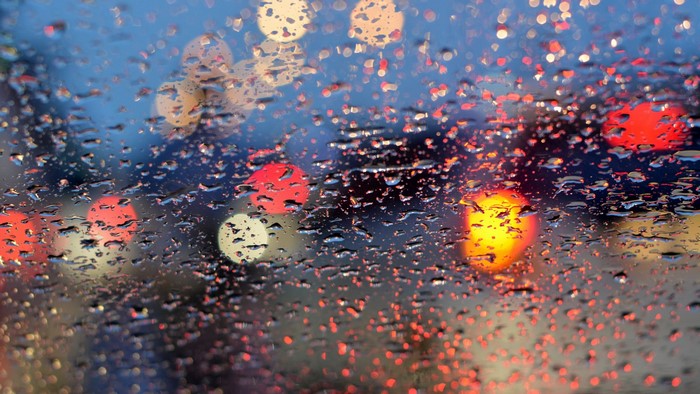 Raindrops on glass with bokeh lights