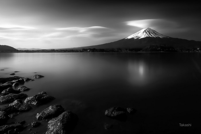 Monochrome long exposure of Mount Fuji over a lake