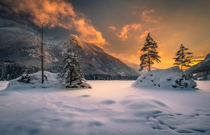 Winter sunset over snowy landscape in Bavaria, Germany