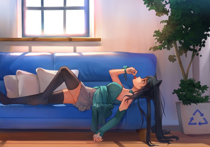 Anime girl with cat ears eating a cherry on a couch