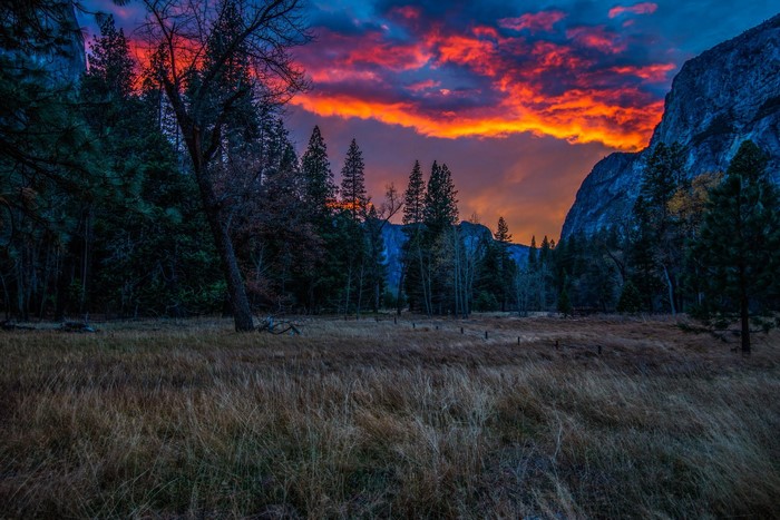 Sunset over Yosemite Valley with mountains and trees