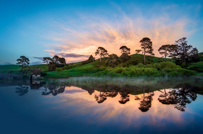 Hobbiton lake at sunset with reflections