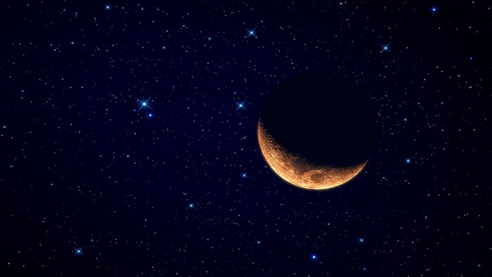 Crescent moon in a starry night sky