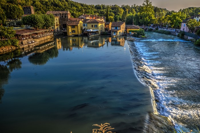 River flowing through a village in Italy