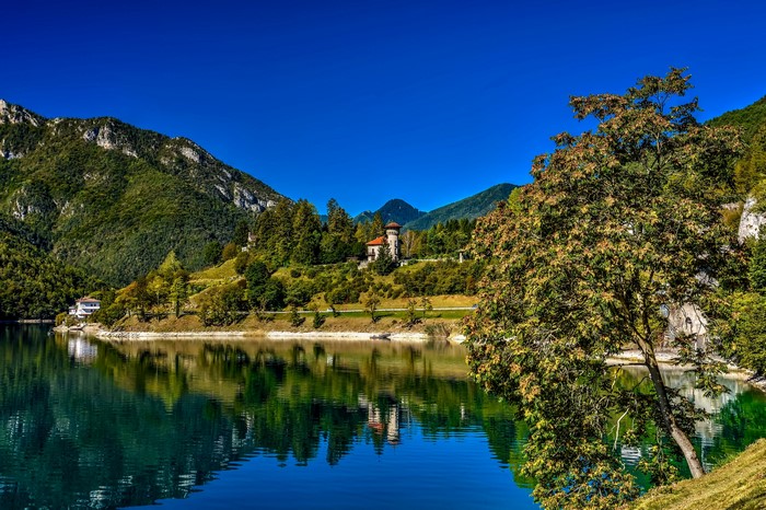 Lake and mountains with reflection in Italy