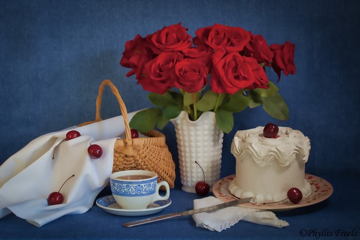 Still life with red roses, cake, and tea