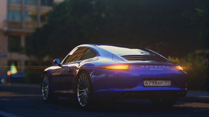 Blue Porsche 911 Carrera on a street