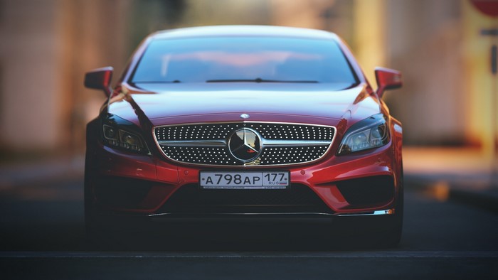 Red Mercedes-Benz car with Russian license plate