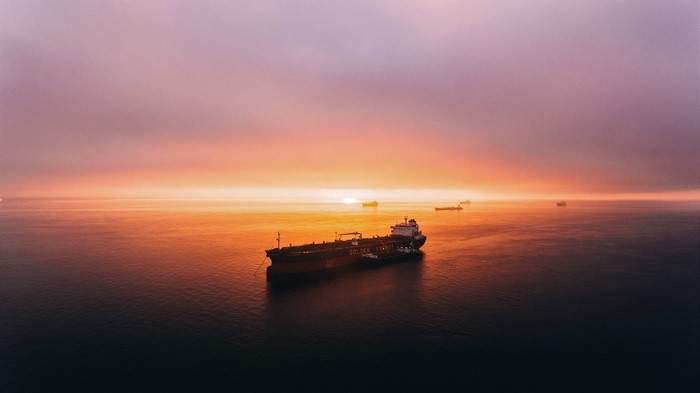 Oil tanker and tug boats at sunset in San Francisco Bay