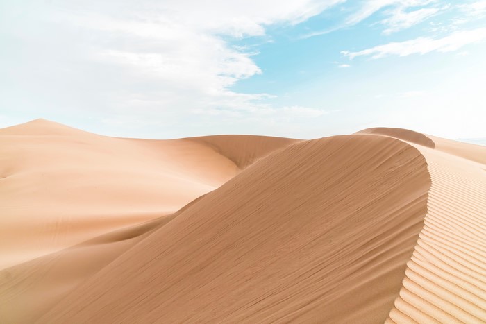 4K bright sand dunes under a cloudy sky