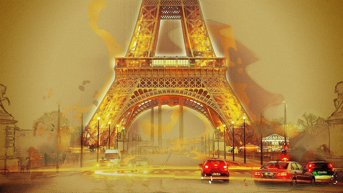 Eiffel Tower at night with traffic