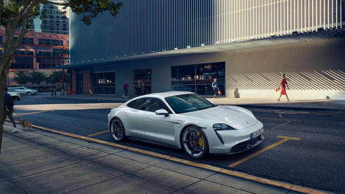 White Porsche Taycan parked on city street