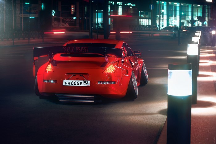 Red Nissan 350Z with custom spoiler at night
