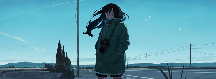 Girl with camera on a road at dusk