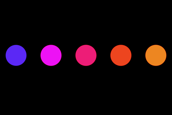 Five colored dots on a black background
