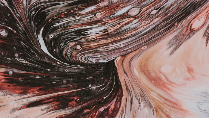 Abstract swirling paint with pink and black colors