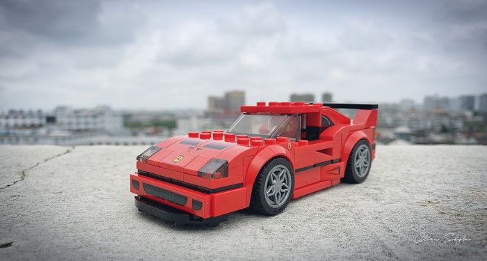 Red LEGO Ferrari F-40 on a rooftop