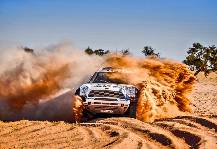 Mini Rally Car Racing Through Sand Dunes